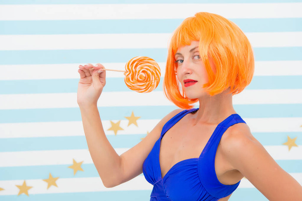 happy pinup model with lollipop. Fashion girl with orange hair have fun. Cool girl with lollipop. Sexy woman. Crazy girl in playful mood. Going crazy. Enjoying playtime. Sweet look. So much fun - Foto, imagen
