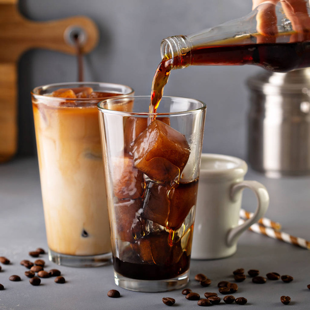 Iced coffee in tall glasses - Фото, изображение