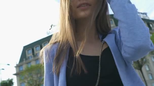 Smiling young woman winking outdoors, health and beauty, urban weekend, glamour - Filmagem, Vídeo