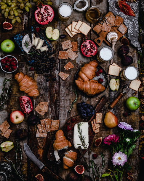 Top view of ingredients for breakfast on old wooden background  - Photo, image