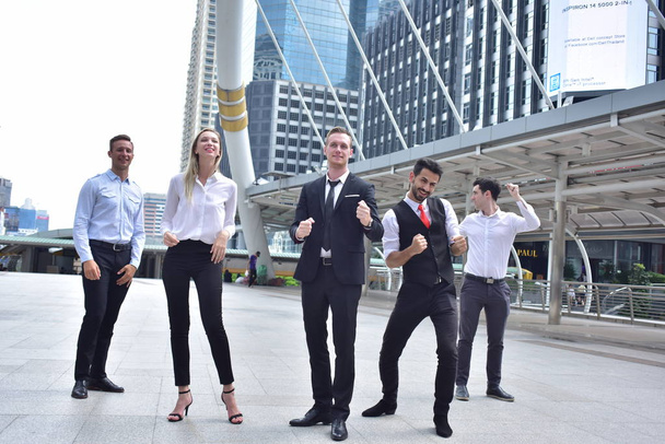 Group of business team posing in city downtown - Photo, Image
