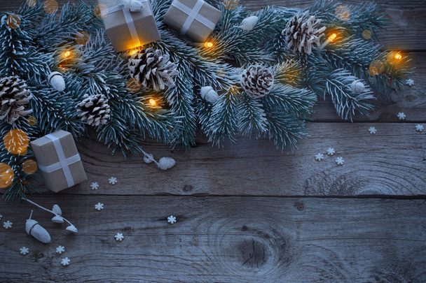 Christmas fir on dark old wooden background - 写真・画像