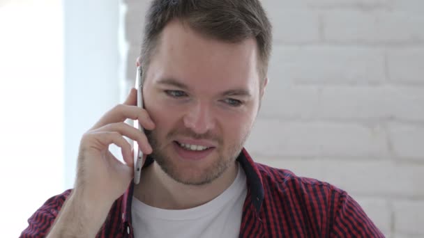 Young Man Talking on Phone in Loft Workplace - Video, Çekim