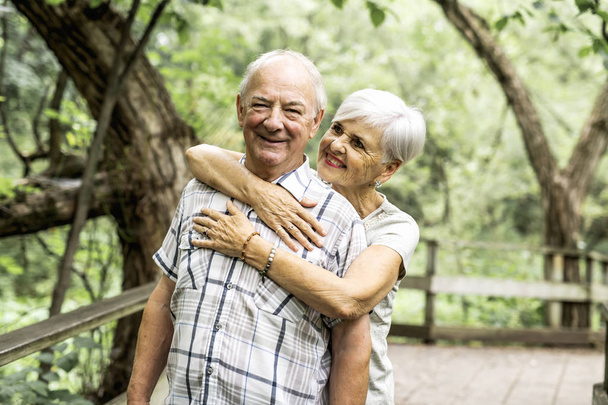 Happy old elderly caucasian couple in a park - Photo, Image