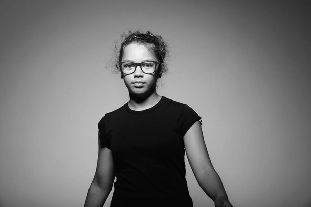 Portrait of teen with glasses in the studio. copy space - Zdjęcie, obraz