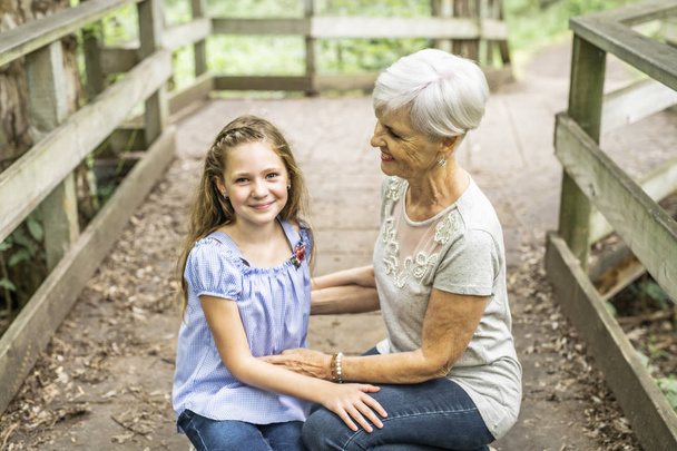 Grandmother and granddaughter spend the weekend in the park - Photo, Image