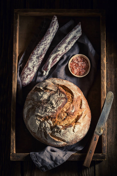 Fresh load of bread with sausage and salt - Foto, Bild