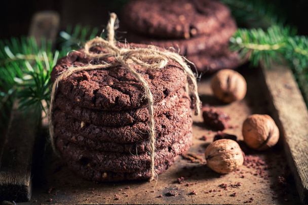 Delicious chocolate cookies on old rustic table - Foto, afbeelding