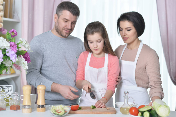 young family cooking together at kitchen - Zdjęcie, obraz