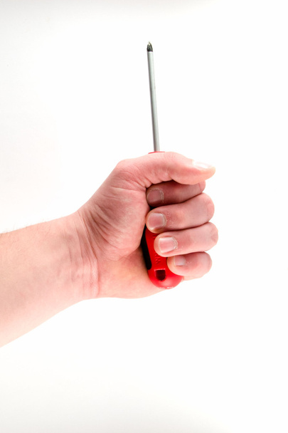 Hand holding screwdriver isolated on white background - Photo, image