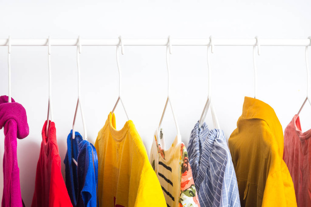 Different clothes on a hanger, lifestyle concept - Foto, imagen