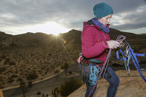 Caucasian woman rock climbing in the California desert - Photo, Image