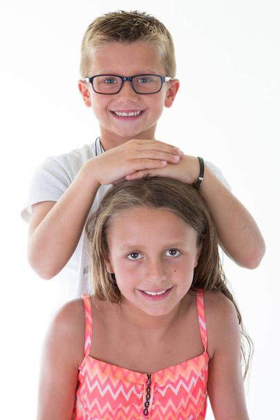 sister and brother child play fun in white studio with love - Photo, Image