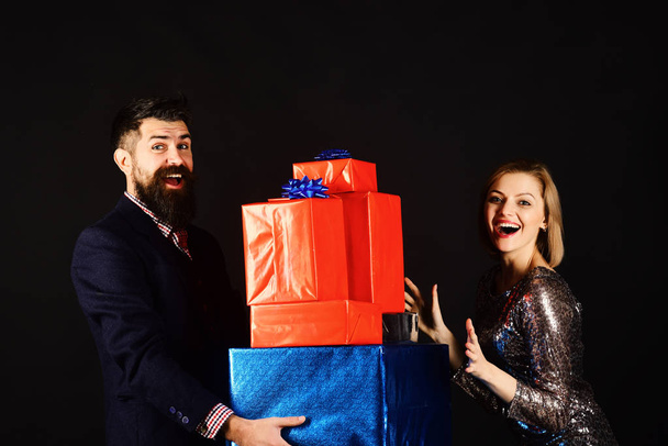 Christmas family concept. Couple in love holds stack of presents - Foto, Imagem