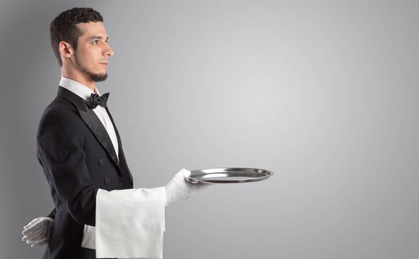 Waiter serving with white gloves and steel tray - Zdjęcie, obraz