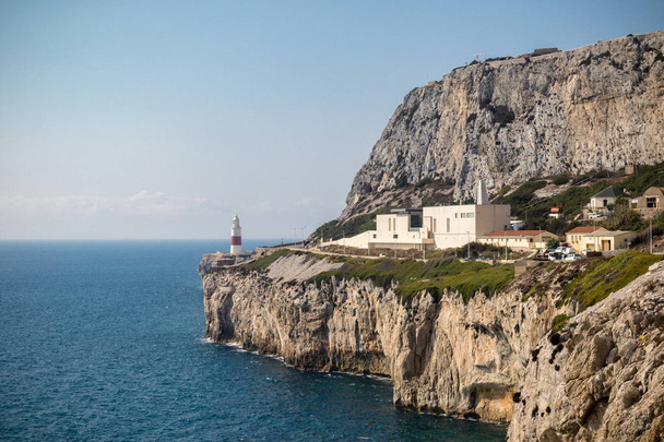 Gibraltar, United Kingdom, 2nd October 2018:-Gibraltar crematorium with Europa Point lighthouse in the background, Europa Point, Gibraltar. Gibraltar is a British Overseas Territory located on the southern tip of Spain. - Foto, immagini