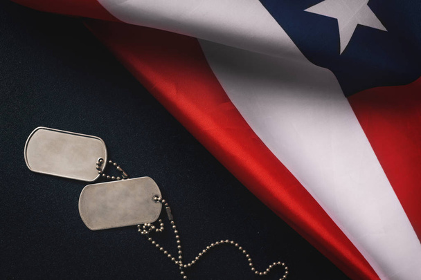 American flag and soldiers tags on wooden background.Veterans Day Concept. - Zdjęcie, obraz