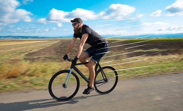 Casual bisikletçi binicilik bisiklet çok hızlı - Fotoğraf, Görsel