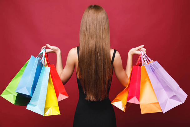 Attractive Woman Holding Many Shopping Bags - Foto, Imagen