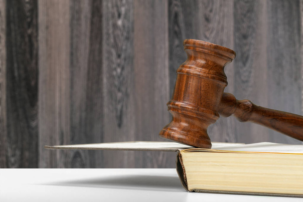 Wooden gavel and books on wooden table - Photo, Image