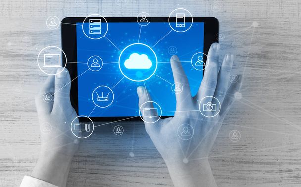 Hand using tablet with centralized cloud computing system concept - Fotografie, Obrázek