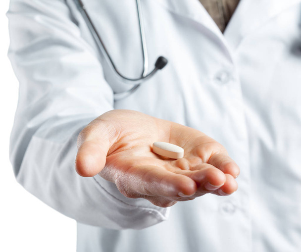 Female doctor holding a pills Isolated on white background  - Photo, Image