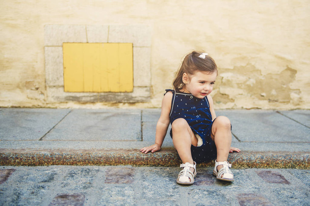 two years old child girl on urban street - Φωτογραφία, εικόνα