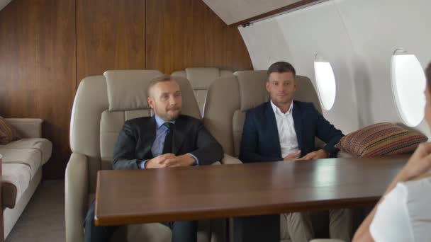 Premium view of businesspeople have meeting in corporate jet - Footage, Video