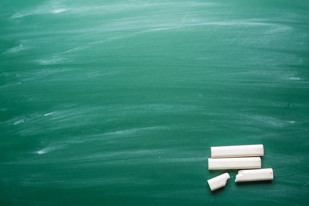 chalk pieces on a chalkboard on background,close up - Photo, Image