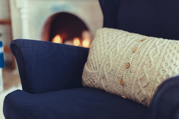 Blue arm-chair with knitted beige pillow,modern interior - Fotografie, Obrázek