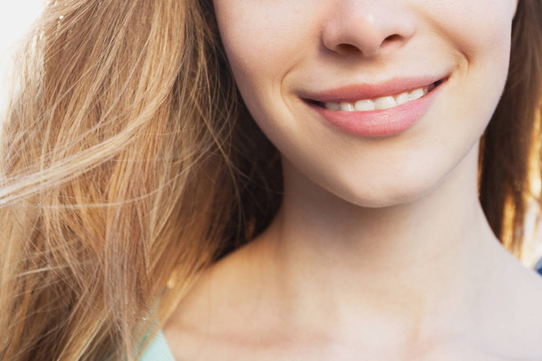 Beautiful smile of young pretty girl close up portrait. Medicine and beauty concept - Foto, imagen