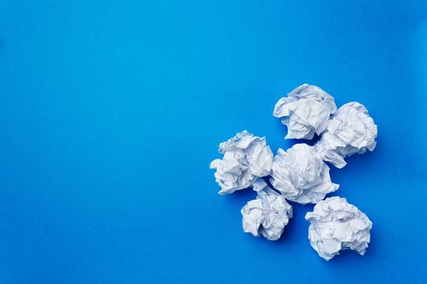 close up of balls of white paper on blue background  - Valokuva, kuva