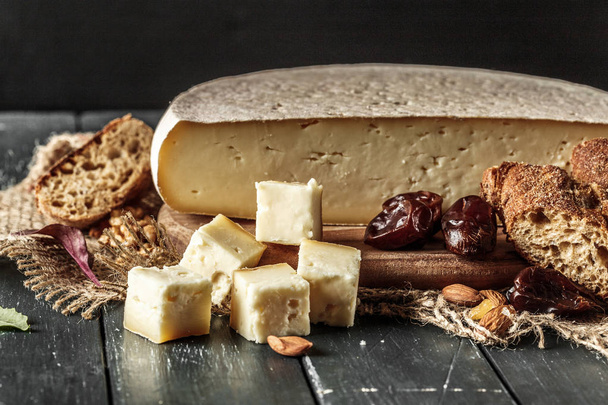 Cheese on the wooden table - Photo, image