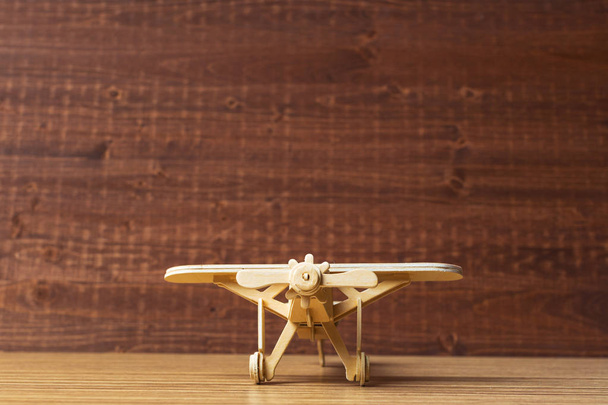  close up of wooden toy airplane on the table - Foto, Imagen