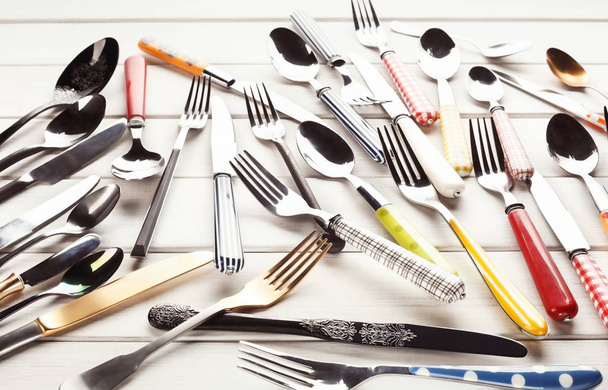 Collection of modern and antique cutlery, top view - Photo, Image