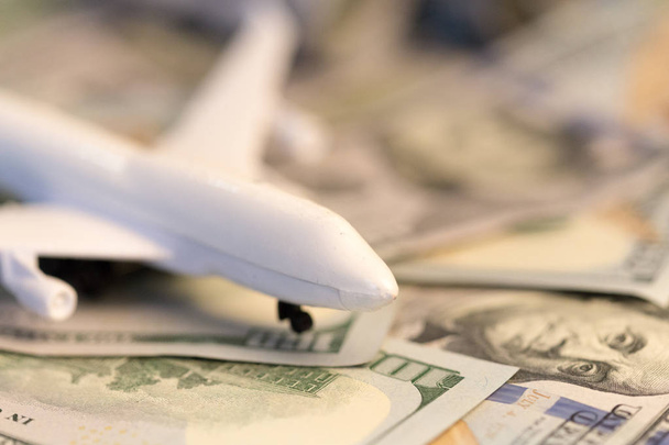 close up of toy airplane on the money banknotes - Foto, imagen