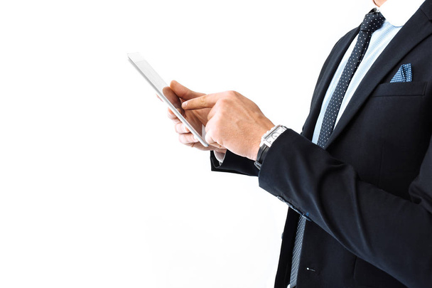 Hands close-up, Business man, in suit and glasses, working on digital tablet, standing on white background - Photo, image