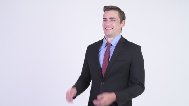 Joven feliz guapo hombre de negocios aplaudiendo de la mano
 - Imágenes, Vídeo