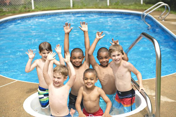 Children in outside swimming pool - Фото, изображение