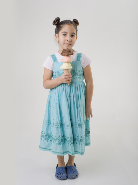 Little girl a cone with three ice cream flavors - 写真・画像