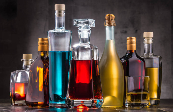 Composition with carafe and bottles of assorted alcoholic beverages. - Photo, Image