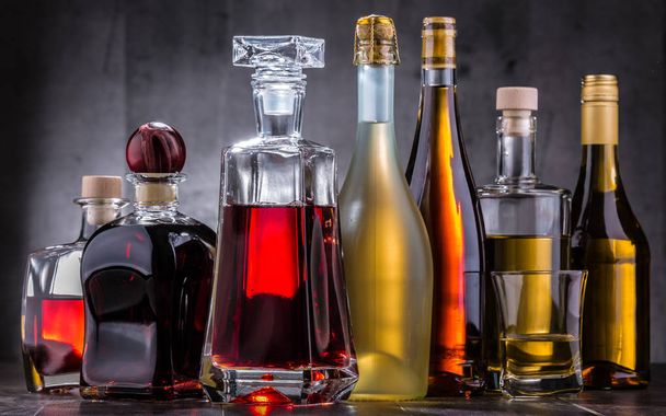 Composition with carafe and bottles of assorted alcoholic beverages. - Photo, Image