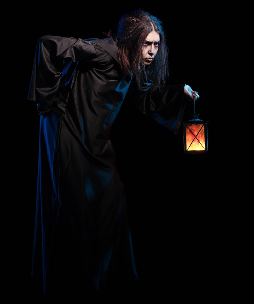 Scary witch isolated on black version - 写真・画像