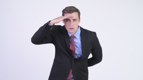 Young handsome businessman searching something - Séquence, vidéo