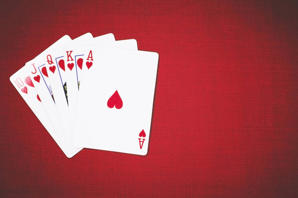 Poker Hands Royal Flush 3. Five playing cards - the poker royal flush hand. Royal Flash, card deck, poker royal flash on cards and poker chips on green casino table. success in gambling. soft focus - Φωτογραφία, εικόνα