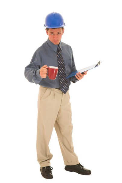 Man standing with coffee and clipboard. - Fotografie, Obrázek
