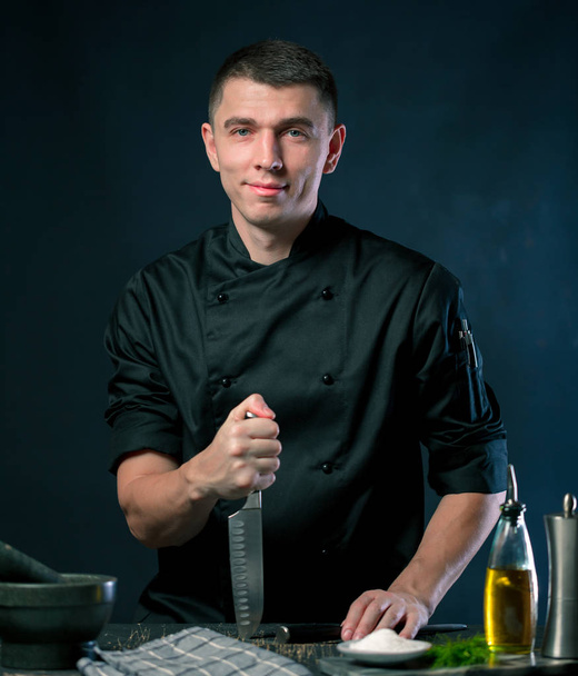 male Chef in restaurant kitchen  - Fotó, kép