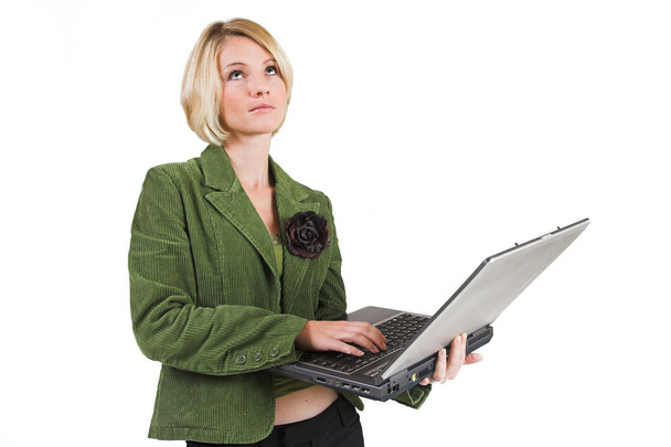 Business woman green jacket, working on laptop - Foto, afbeelding