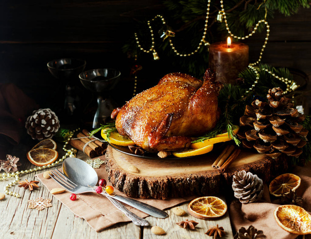 Roast chicken or turkey for Christmas Dinner and New Year with mulled wine and Christmas decorations, space for text, selective focus - Foto, immagini