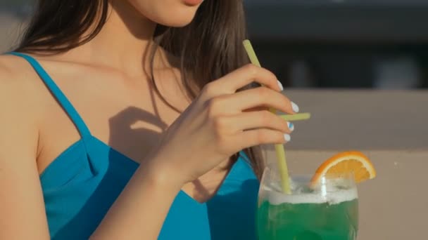 Young asian fashion woman drinking cocktail in a beach bar. - Imágenes, Vídeo